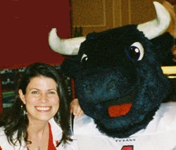 Picture of Stephanie Stradley and the Houston Texans mascot, Toro.